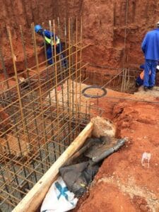 Construction workers installing rebar for foundation at Pinnacle Structural Repairs.